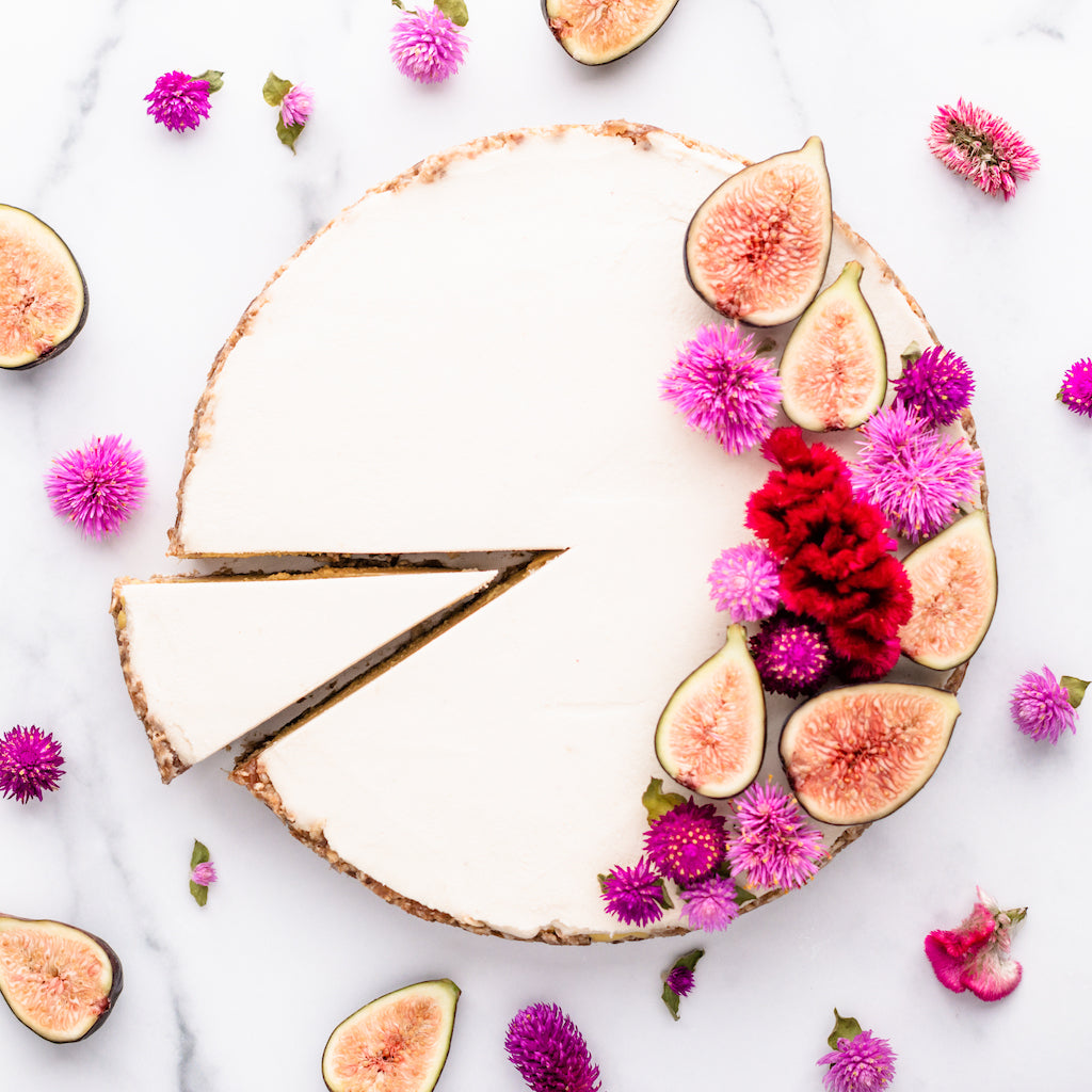 vegan cashew cream cheesecake with peaches figs and elderberry syrup